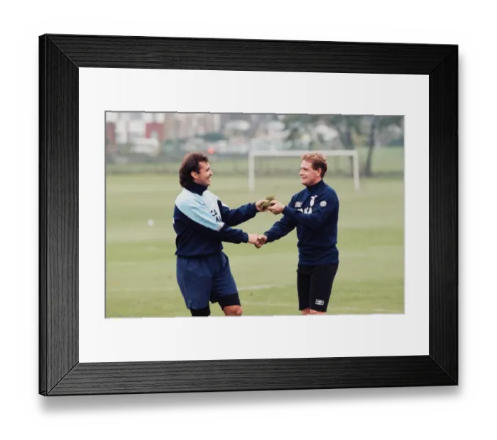 Framed Print : Lazio footballer Paul Gascoigne is handed a piece of turf by teammate Roberto Cravero