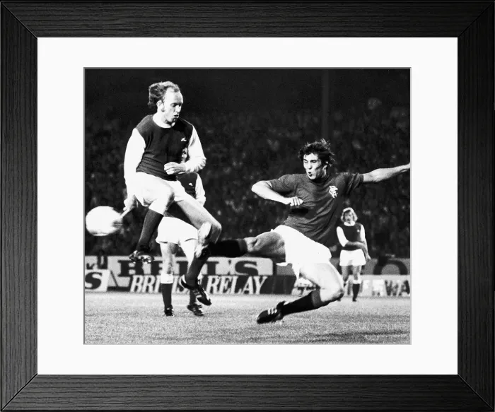 Framed Print : Ally Scott of Hibernian leaps in the air to avoid the legs of Rangers Framed Print : Ally Scott of Hibernian leaps in the air to avoid the legs of Rangers