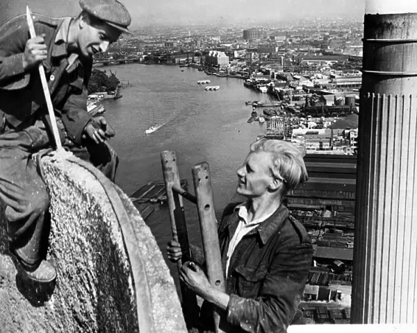Steeplejacks working on the north west tower chimney of Battersea Power Station