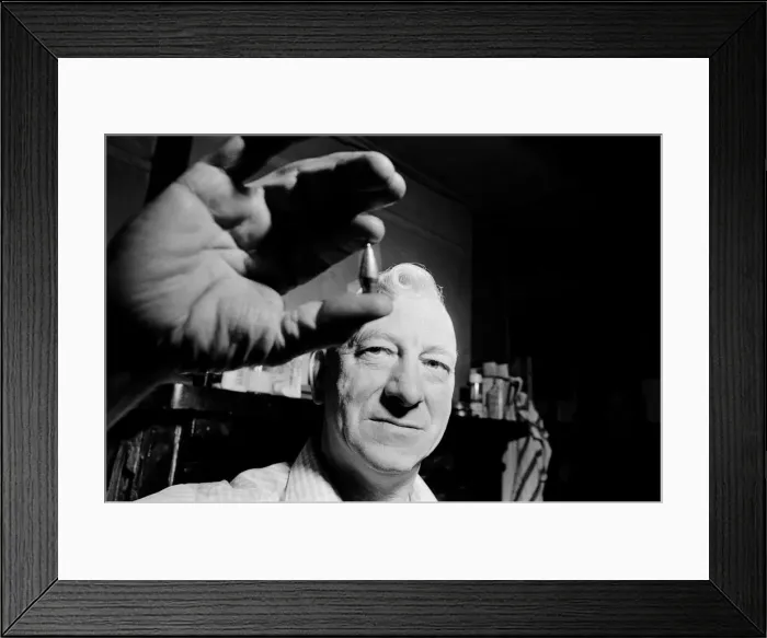 Framed Print : Ernest Stamford from Sheffield displays one of his hand made fishing weights Framed Print : Ernest Stamford from Sheffield displays one of his hand made fishing weights