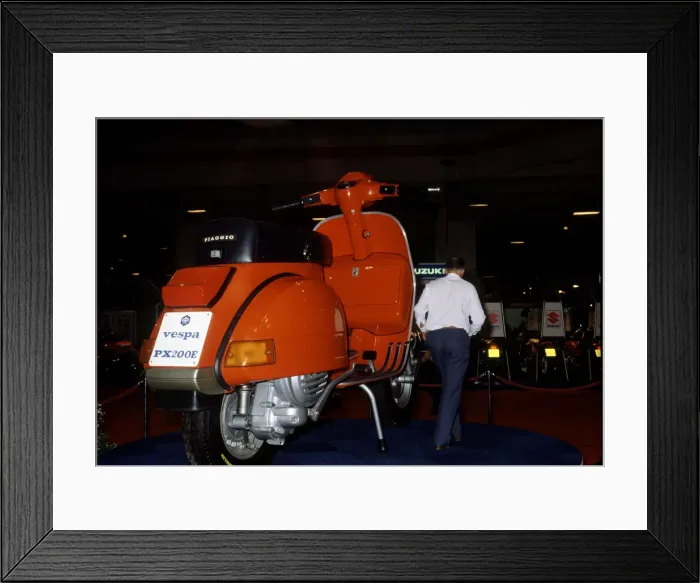 Framed Print : A Vespa Scooter at the 1983 Earls Court Motorcycle Show. 19th August 1983 Framed Print : A Vespa Scooter at the 1983 Earls Court Motorcycle Show. 19th August 1983