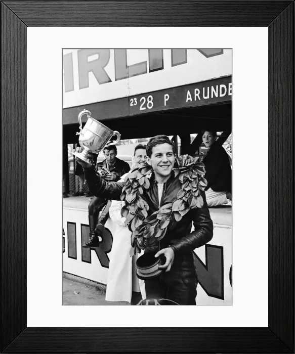 Framed Print : Motor Cycle Racing at Oulton Park. Phil Read celebrates with the trophy after Framed Print : Motor Cycle Racing at Oulton Park. Phil Read celebrates with the trophy after