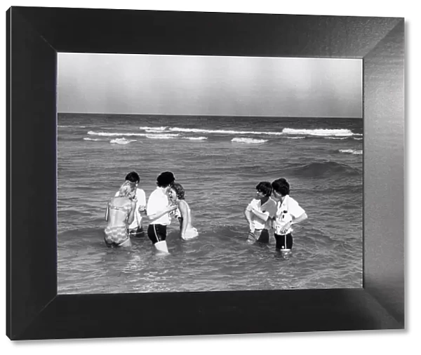 The Beatles swimming in Miami with some female admirers. 14th February 1964