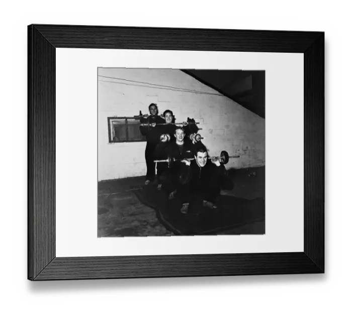 Framed Print : Denis Law training with his Huddersfield teammates before their upcoming FA Cup tie