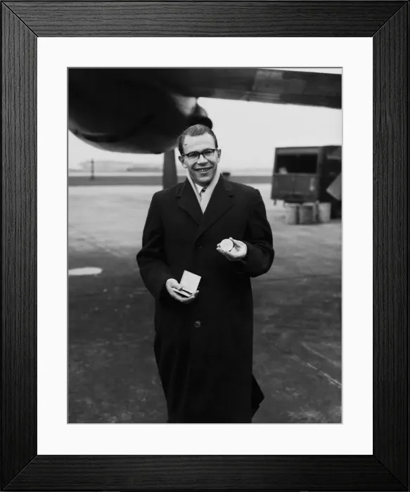 Framed Print : British athlete Chris Brasher shows off his gold medal which he won at the 1956 Olympic Framed Print : British athlete Chris Brasher shows off his gold medal which he won at the 1956 Olympic