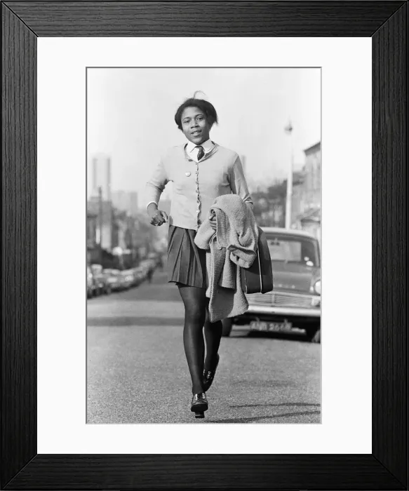 Framed Print : Schoolgirl runner Sonia Lannaman, aged 14, pictured on her way home from school in Framed Print : Schoolgirl runner Sonia Lannaman, aged 14, pictured on her way home from school in