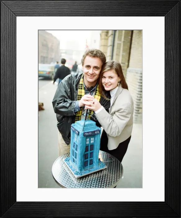 Framed Print : Dr Who, Sylvester McCoy with his assistant Ace alias Sophie Aldred cutting a cake in Framed Print : Dr Who, Sylvester McCoy with his assistant Ace alias Sophie Aldred cutting a cake in
