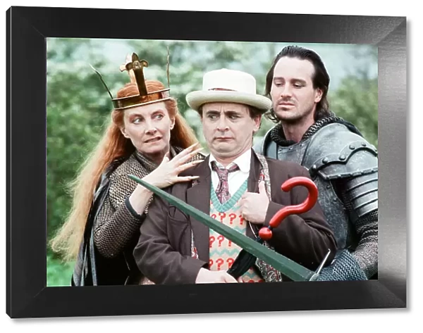 Christopher Bowen as Mordred crosses swords with Sylvester McCoy as the Doctor along