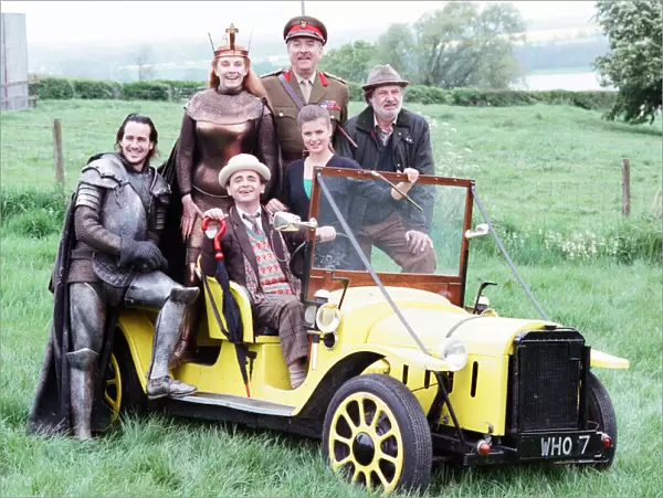 Sylvester McCoy as the Doctor behind the wheel, Christopher Bowen as Mordred