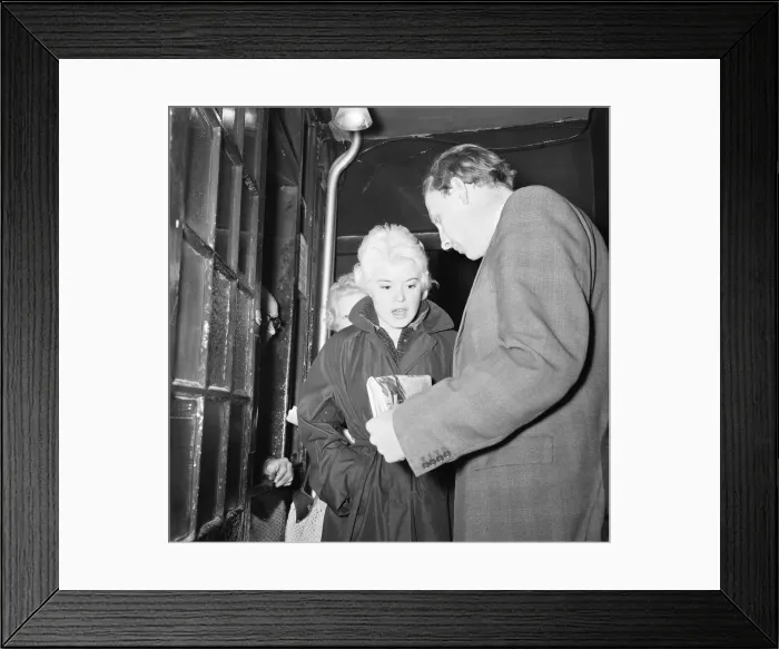 Framed Print : Peter Woods Daily Mirror Reporter showing singer Shani Wallis the story of her alleged Framed Print : Peter Woods Daily Mirror Reporter showing singer Shani Wallis the story of her alleged