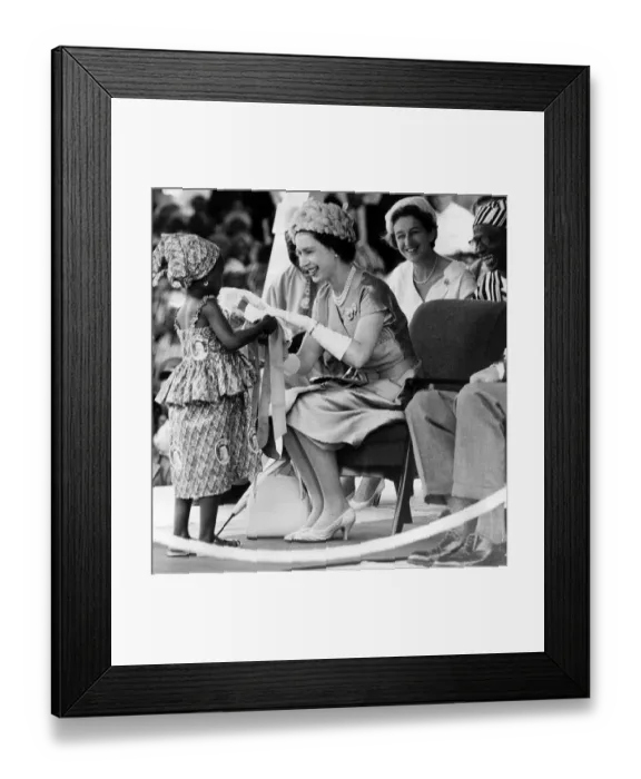 Framed Print : Her Majesty Queen Elizabeth II receives a bouquet with ribbons from Mamawo Kaikai Framed Print : Her Majesty Queen Elizabeth II receives a bouquet with ribbons from Mamawo Kaikai