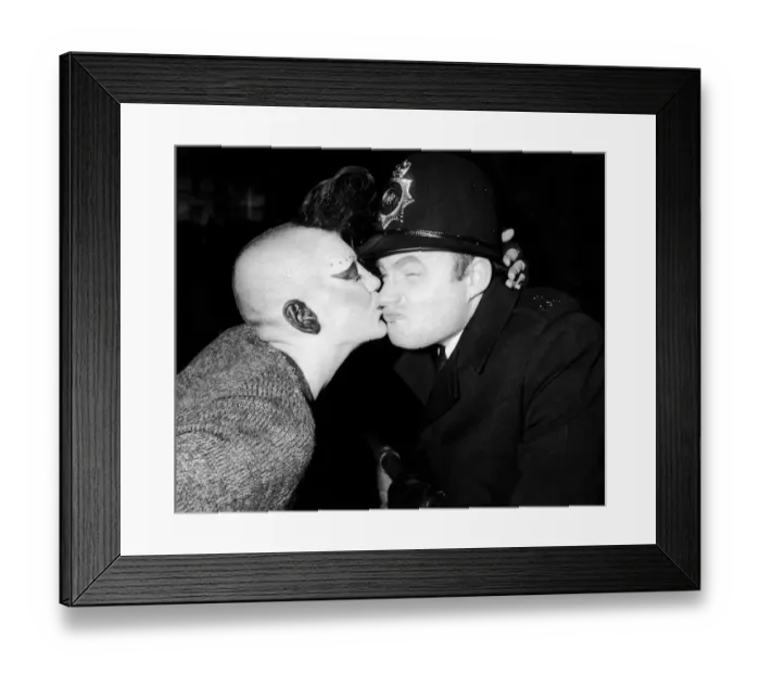 Framed Print : New Years Reveller 1984. So Friendly: A policeman is kissed by a girl punk, Beccy Massey Framed Print : New Years Reveller 1984. So Friendly: A policeman is kissed by a girl punk, Beccy Massey