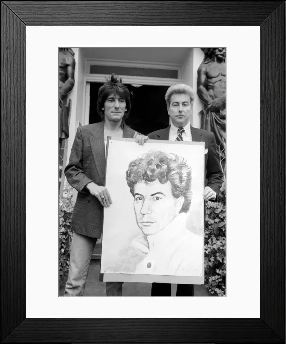 Framed Print : Rolling Stones: Ronnie Wood holds a painting of author Ken Follett who stands next to him Framed Print : Rolling Stones: Ronnie Wood holds a painting of author Ken Follett who stands next to him