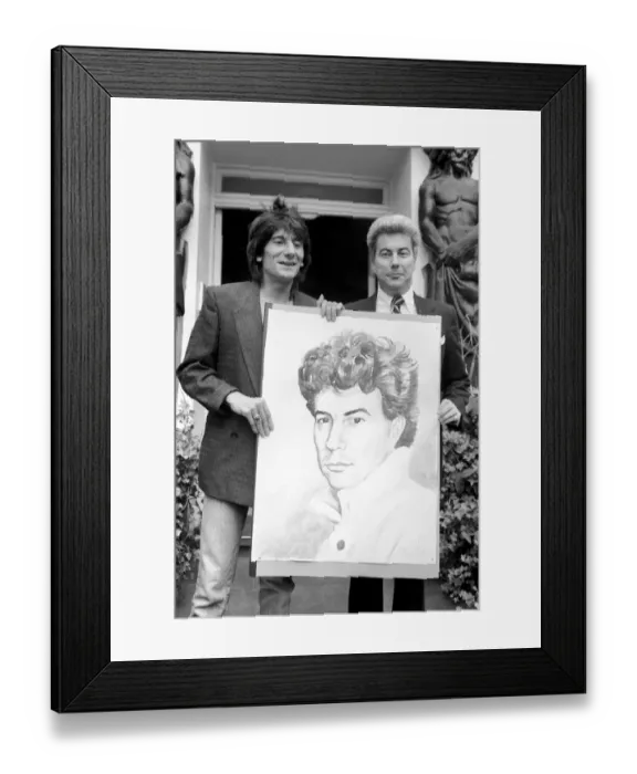 Framed Print : Rolling Stones: Ronnie Wood holds a painting of author Ken Follett who stands next to him Framed Print : Rolling Stones: Ronnie Wood holds a painting of author Ken Follett who stands next to him