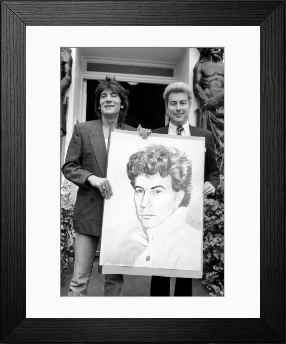 Framed Print : Rolling Stones: Ronnie Wood holds a painting of author Ken Follett who stands next to him Framed Print : Rolling Stones: Ronnie Wood holds a painting of author Ken Follett who stands next to him