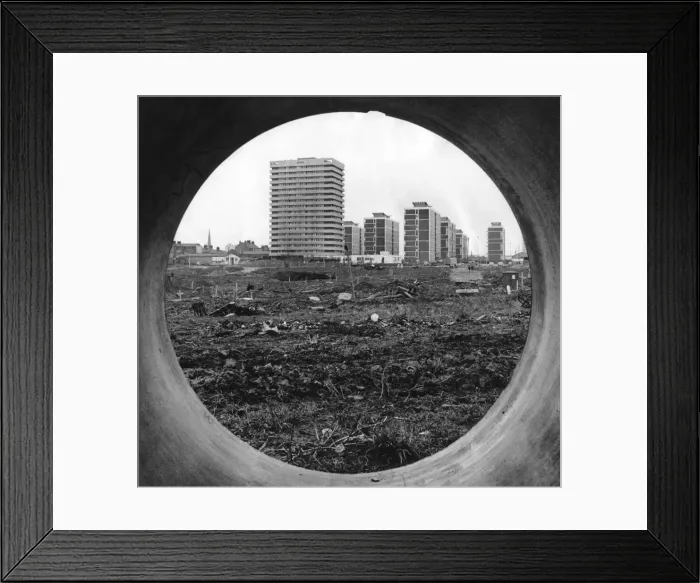 Framed Print : The concrete circle of a sewer pipe outlines the rapidly changing scene Framed Print : The concrete circle of a sewer pipe outlines the rapidly changing scene