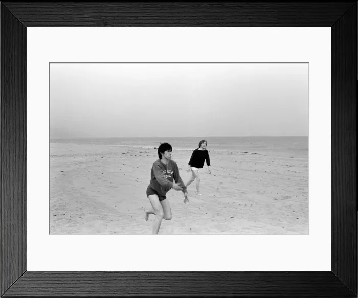 Framed Print : The Rolling Stones. Keith Richards and Brian Jones seen here posing on Malibu beach