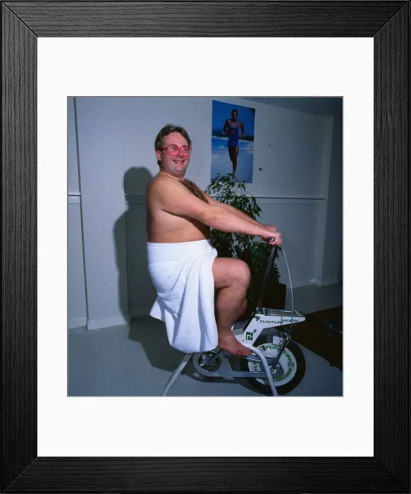 Framed Print : Christopher Biggins 1985 on exercise bicycle gymnasium Framed Print : Christopher Biggins 1985 on exercise bicycle gymnasium