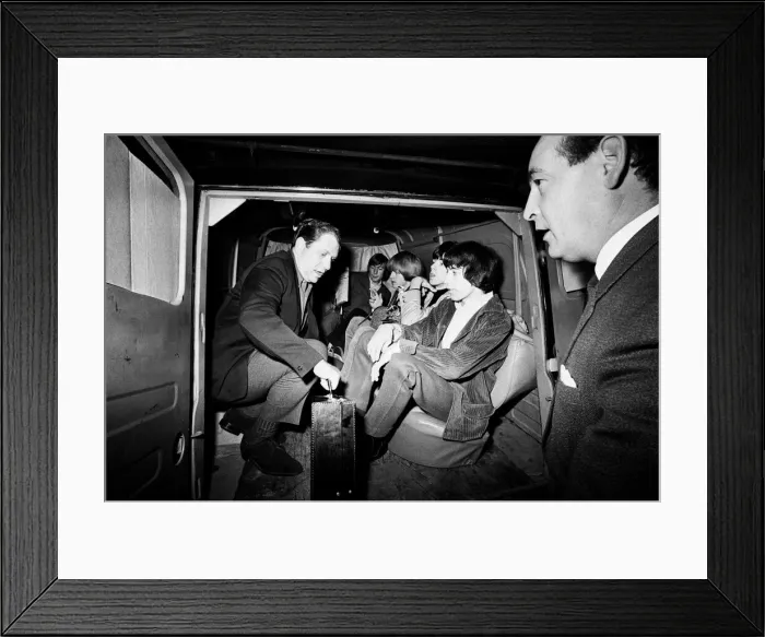 Framed Print : The Rolling Stones bundled in a van outside Manchesters Piccadily Hotel