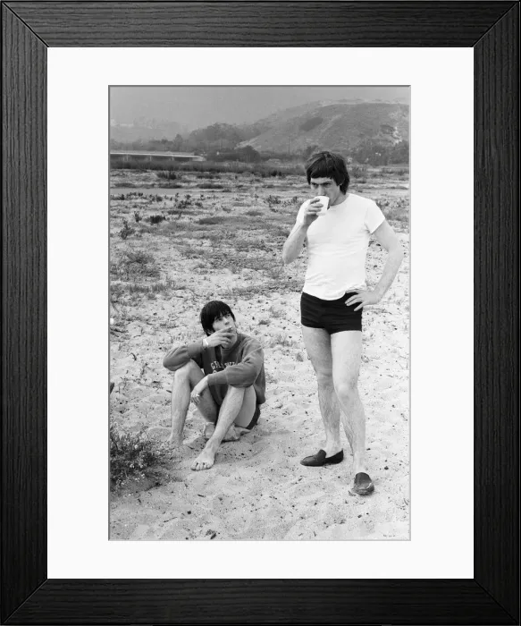 Framed Print : The Rolling Stones. Keith Richards and Charlie Watts seen here posing on Malibu beach