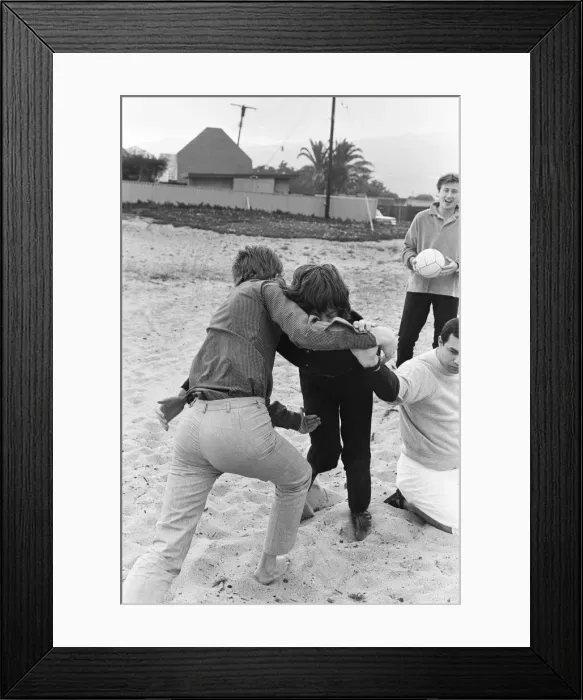 Framed Print : The Rolling Stones. Mick Jagger and manager Andrew Loog Oldham seen here wrestling
