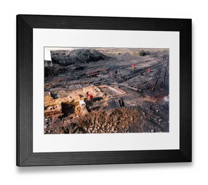Framed Print : Archaeologists digging up a perfectly preserved wooden railway which had lain buried Framed Print : Archaeologists digging up a perfectly preserved wooden railway which had lain buried