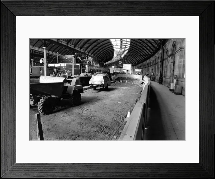 Framed Print : Workman were ripping up hundreds of expensive marble floor tiles after a British Rail bid