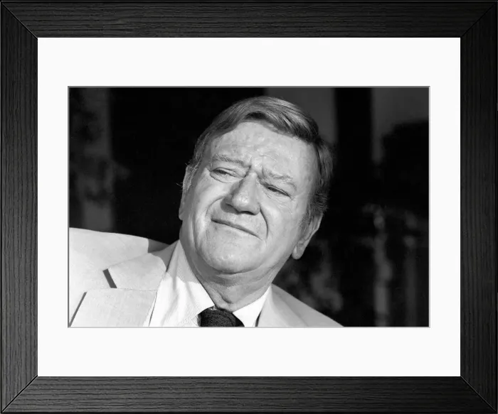 Framed Print : John Wayne who stars in Brannigan seen here at home in Texas Framed Print : John Wayne who stars in Brannigan seen here at home in Texas