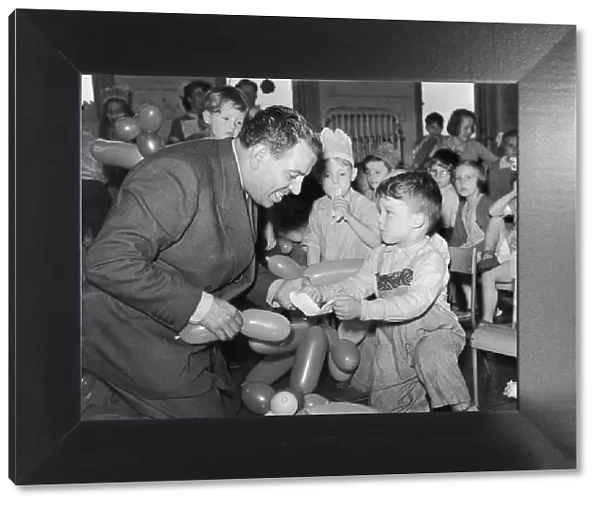 Music Hall comedian Hal Monty seen here entertaining the children of the Pendlebury