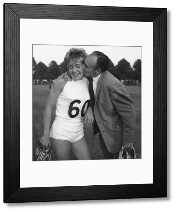 Framed Print : Lillian Board after breaking her own 880 yard track record at Reading gets a kiss Framed Print : Lillian Board after breaking her own 880 yard track record at Reading gets a kiss