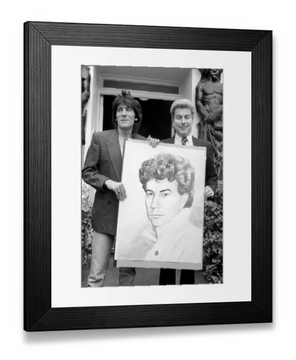 Framed Print : Rolling Stones: Ronnie Wood holds a painting of author Ken Follett who stands next to him Framed Print : Rolling Stones: Ronnie Wood holds a painting of author Ken Follett who stands next to him