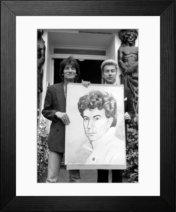 Framed Print : Rolling Stones: Ronnie Wood holds a painting of author Ken Follett who stands next to him Framed Print : Rolling Stones: Ronnie Wood holds a painting of author Ken Follett who stands next to him
