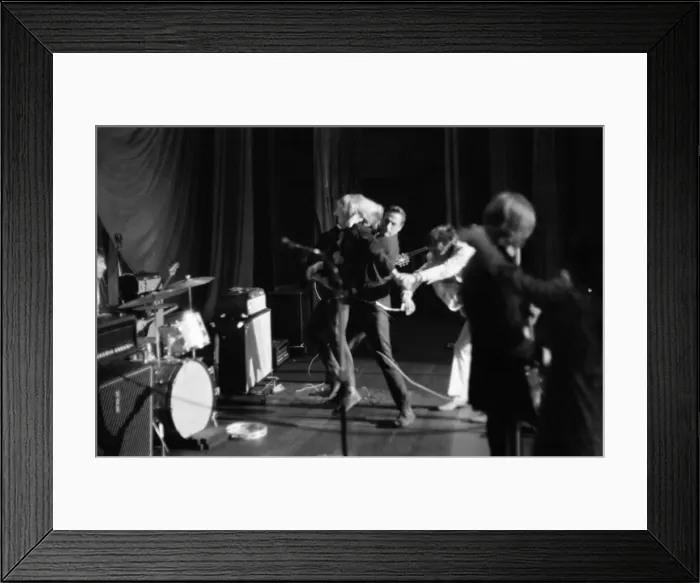 Framed Print : Rolling Stones Concert in Manchester. Sequence: A girl rushes on stage e pulls Mick Framed Print : Rolling Stones Concert in Manchester. Sequence: A girl rushes on stage e pulls Mick