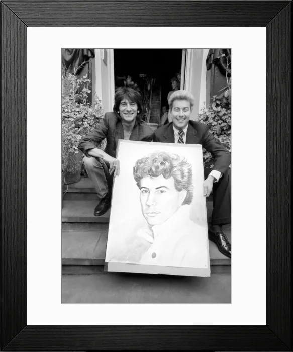 Framed Print : Rolling Stones: Ronnie Wood holds a painting of author Ken Follett who stands next to him Framed Print : Rolling Stones: Ronnie Wood holds a painting of author Ken Follett who stands next to him