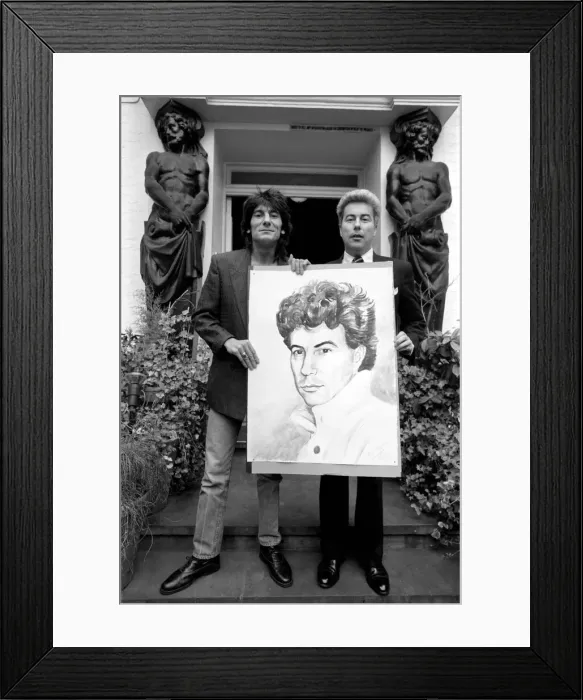 Framed Print : Rolling Stones: Ronnie Wood holds a painting of author Ken Follett who stands next to him Framed Print : Rolling Stones: Ronnie Wood holds a painting of author Ken Follett who stands next to him