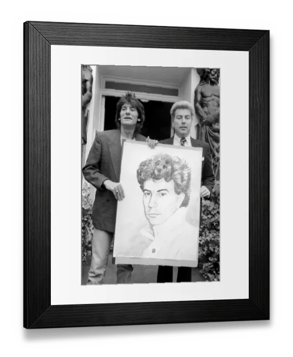 Framed Print : Rolling Stones: Ronnie Wood holds a painting of author Ken Follett who stands next to him Framed Print : Rolling Stones: Ronnie Wood holds a painting of author Ken Follett who stands next to him