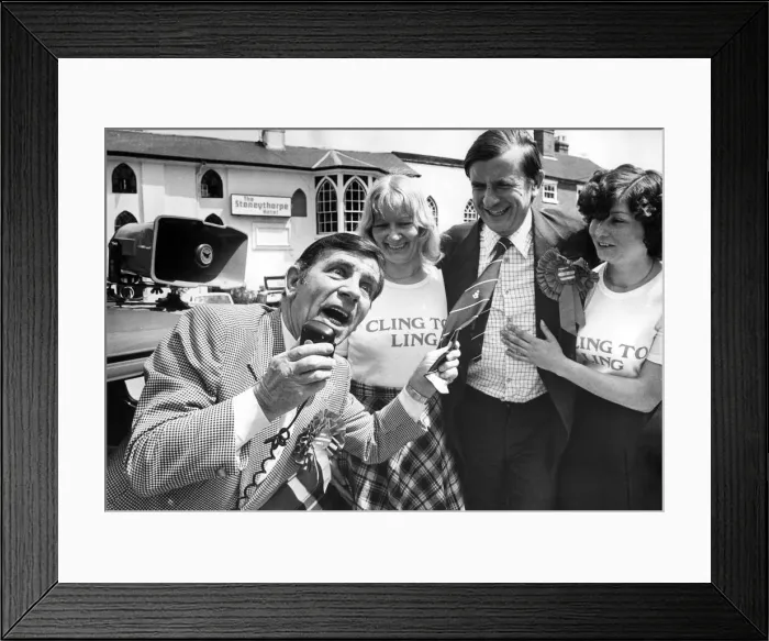 Framed Print : Comedian Norman Wisdom repays a favour by canvassing for Midlands Central Tory candidate