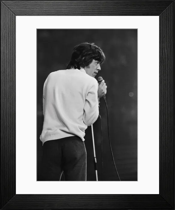 Framed Print : Rolling Stones lead singer Mick Jagger performing on stage at the New Musical Express