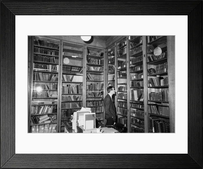 Framed Print : David Rodger, deputy keeper of books at the British Museum looks inside the case Framed Print : David Rodger, deputy keeper of books at the British Museum looks inside the case