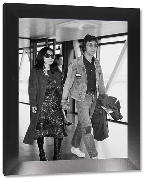 Former Beatle John Lennon with his wife Yoko Ono leaving Heathrow Airport for the Cannes