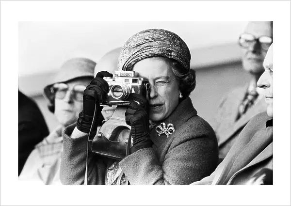 Her Majesty Queen Elizabeth II taking a picture at the Royal Windsor Horse Trials