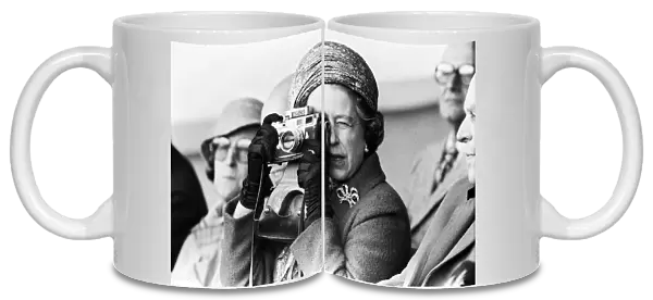 Her Majesty Queen Elizabeth II taking a picture at the Royal Windsor Horse Trials