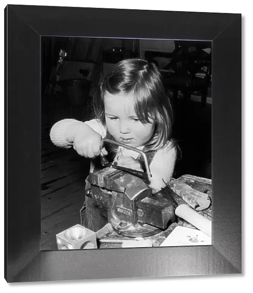 Three year old Pamela Murray working in her dads Silversmiths workshop in Glenrothes
