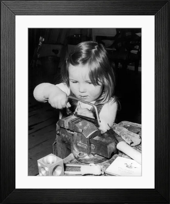 Framed Print : Three year old Pamela Murray working in her dads Silversmiths workshop in Glenrothes Framed Print : Three year old Pamela Murray working in her dads Silversmiths workshop in Glenrothes