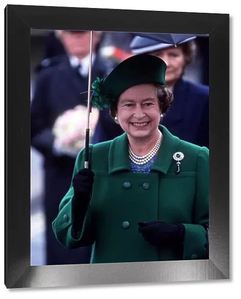 Her Majesty Queen Elizabeth II holds an umbrella during her visit to Torbay to celebrate