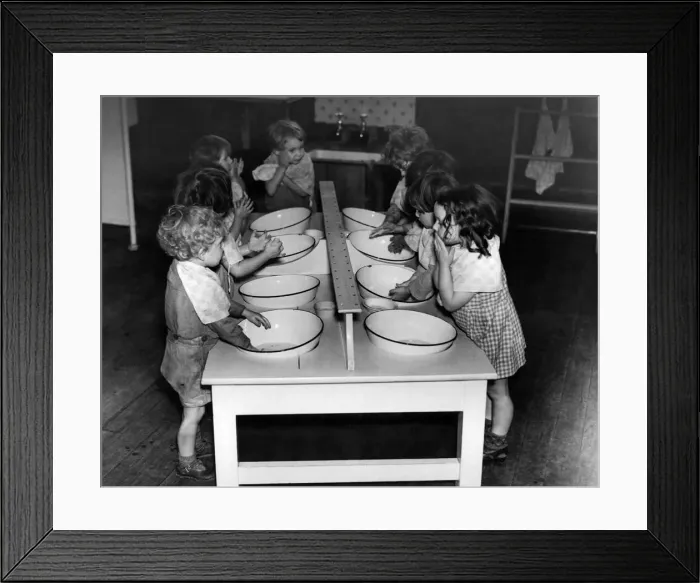 Framed Print : Young children washing themselves in enamal basins during World War Two Framed Print : Young children washing themselves in enamal basins during World War Two