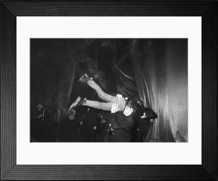 Framed Print : The Rolling Stones at the ABC Cinema in Carlisle. A fan is removed from the stage Framed Print : The Rolling Stones at the ABC Cinema in Carlisle. A fan is removed from the stage