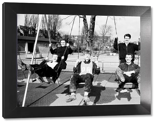 Fulham players on the swings after training was abandoned in London before their FA Cup