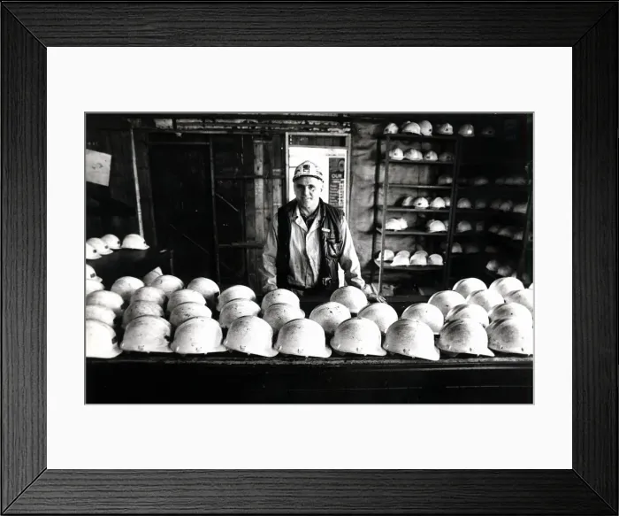 Framed Print : Coal - Miners - Coal miner checks the miners hats at a South Wales Colliery Framed Print : Coal - Miners - Coal miner checks the miners hats at a South Wales Colliery