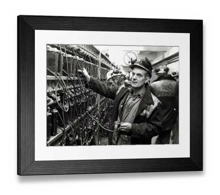Framed Print : Coal - Miners - Coal miner checks his lamp in at the lamp room at a South Wales Colliery Framed Print : Coal - Miners - Coal miner checks his lamp in at the lamp room at a South Wales Colliery